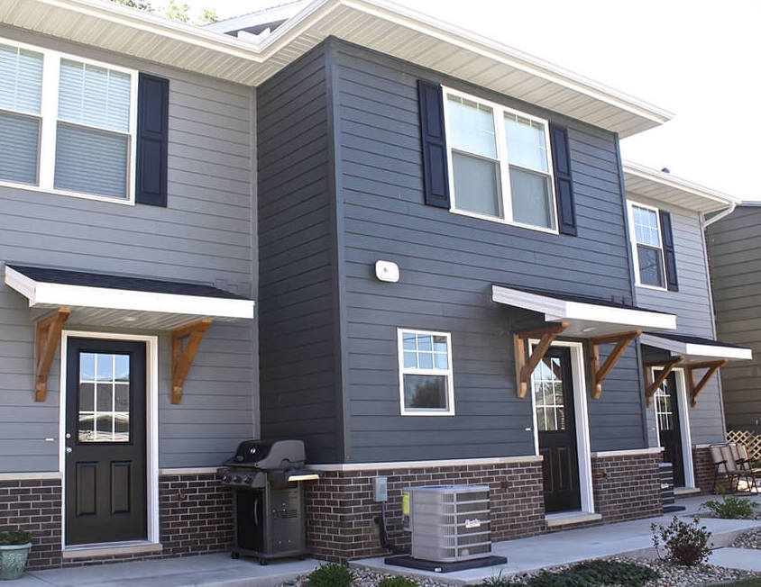 Modern Bay Area home with new fiber cement siding installed by siding contractors in Bay Area CA. The image shows clean horizontal panels, dark trim windows, and a durable exterior finish designed for long-term performance. Best Exteriors serves Northern California from Oakland (1999 Harrison St #10219) and Sacramento (5041 College Oak Dr C), helping homeowners improve curb appeal and protect their property with high-quality siding solutions.